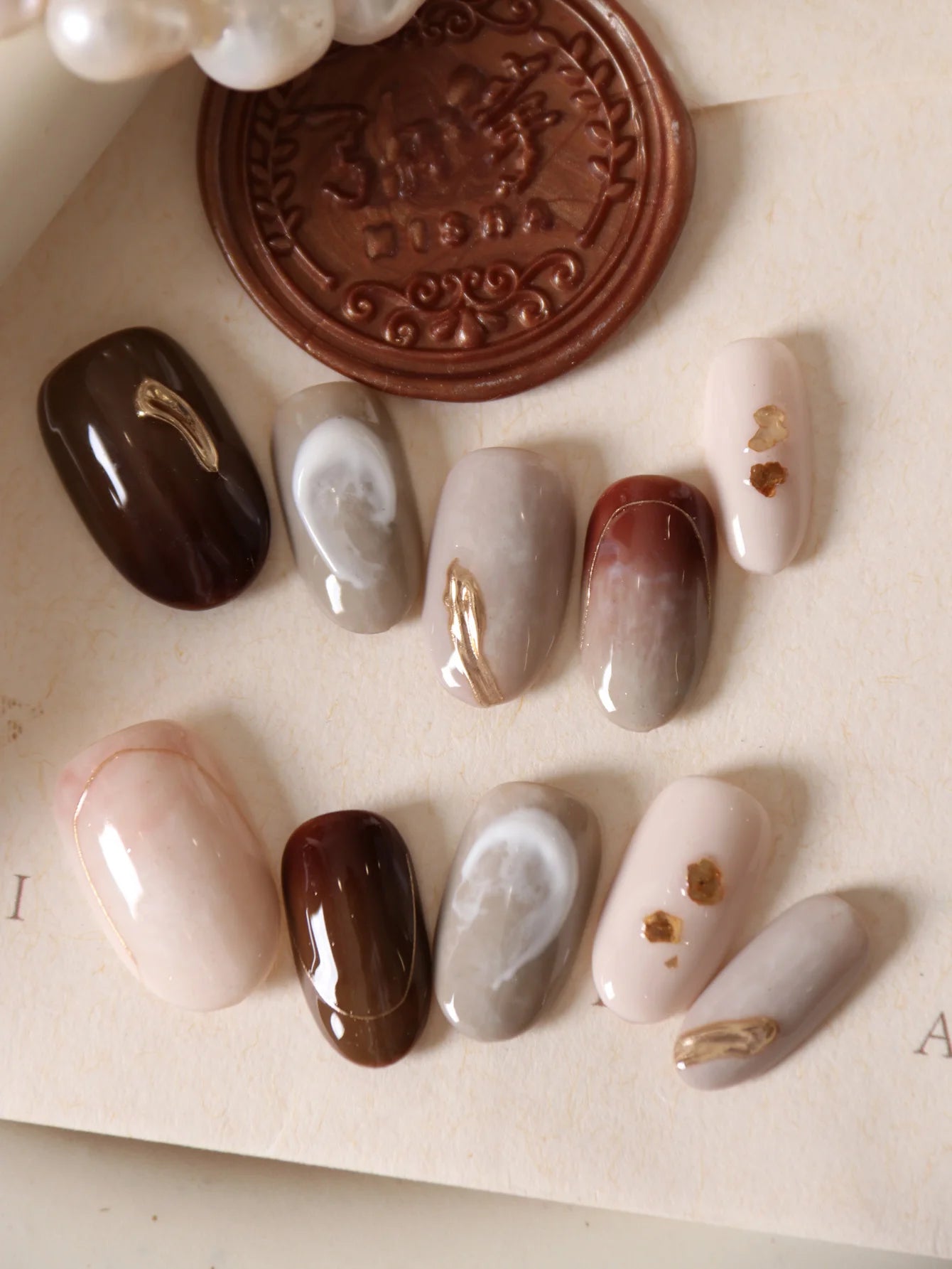 10Pcs Press on Nails Short Brown Nails Halation Acrylic Press on Nails Fake Nails Includes 1 Sheet Adhesive Tabs & 1 Pc Mini File