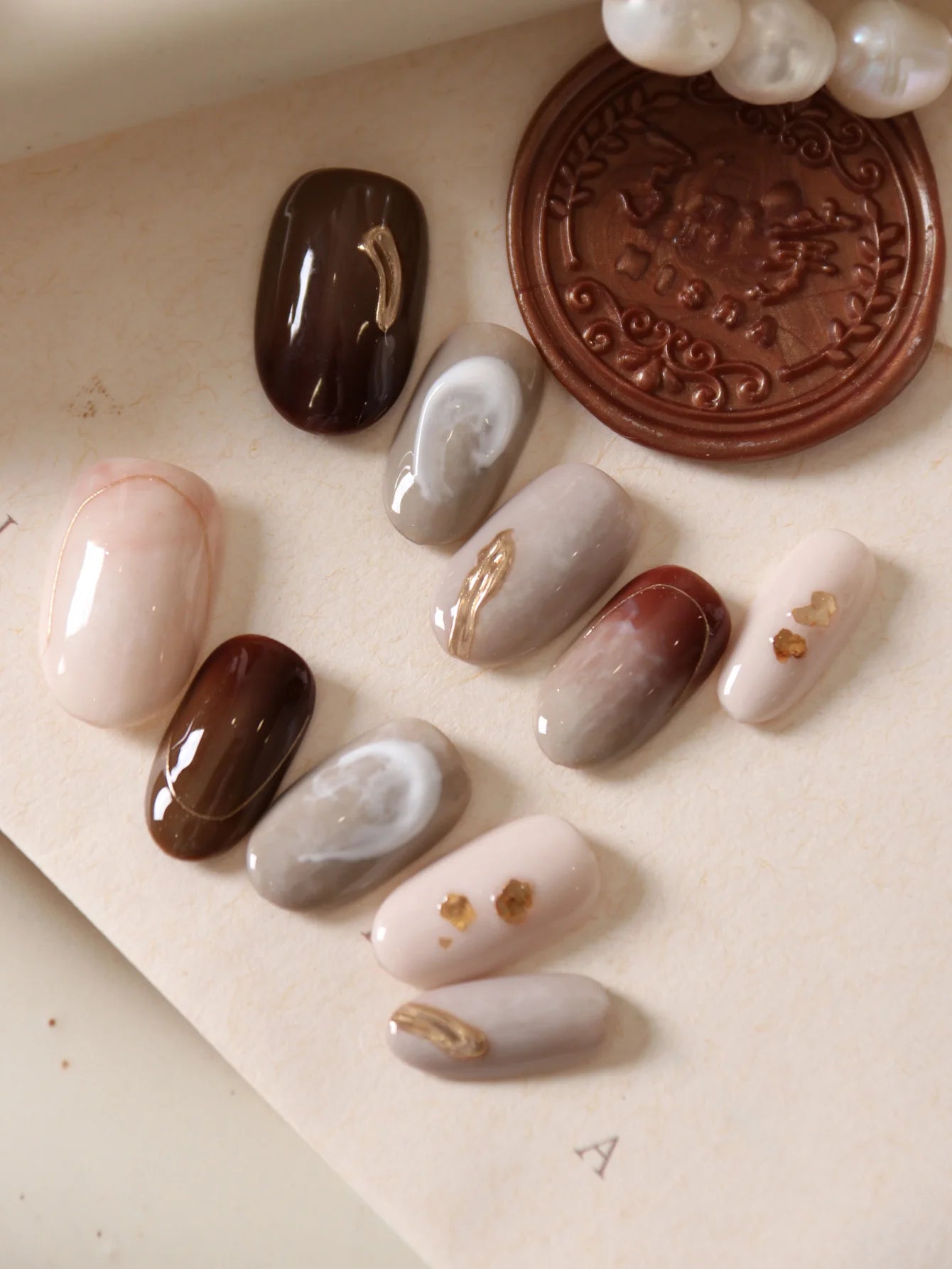 10Pcs Press on Nails Short Brown Nails Halation Acrylic Press on Nails Fake Nails Includes 1 Sheet Adhesive Tabs & 1 Pc Mini File