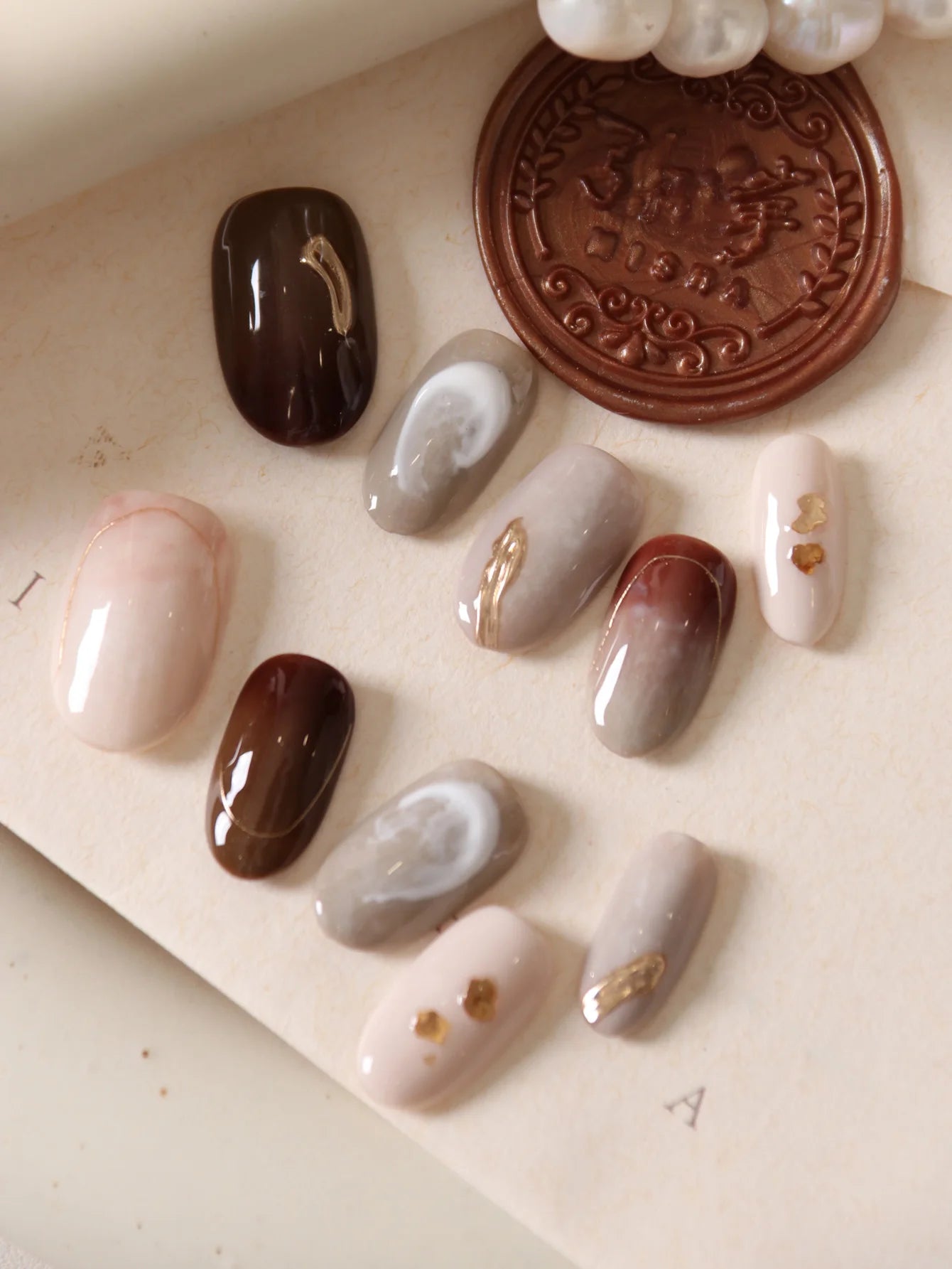 10Pcs Press on Nails Short Brown Nails Halation Acrylic Press on Nails Fake Nails Includes 1 Sheet Adhesive Tabs & 1 Pc Mini File